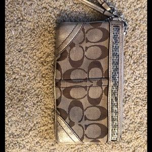Coach logo wristlet with gold metallic trim